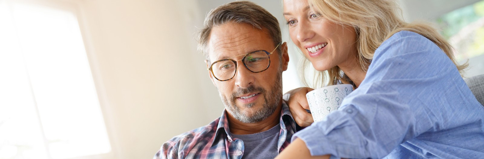 Couple at Home Reviewing Information