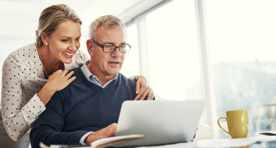 Two People Viewing Laptop